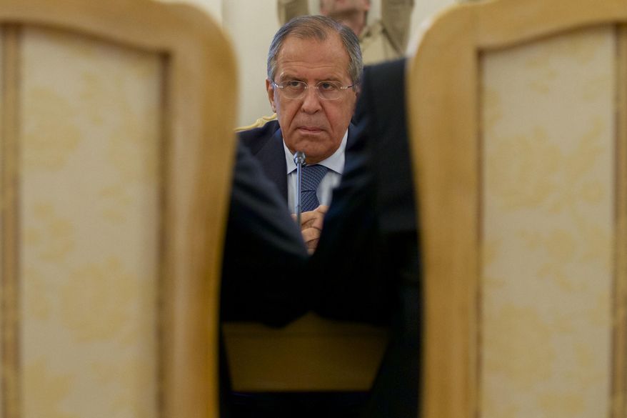 Russian Foreign Minister Sergey Lavrov listens his counterparts Ibrahim Gandour, from Sudan, left, and Benjamin Barnaba, from South Sudan, right, during their trilateral meeting in Moscow, Russia, on Thursday, Sept. 10, 2015. (AP Photo/Ivan Sekretarev)