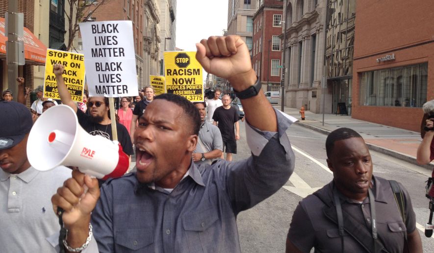 FILE - In a Wednesday, Sept. 2, 2015 file photo, Pastor Westley West, from Faith Empowered Ministries, leads protesters as they march towards Pratt Street and the Inner Harbor, in Baltimore, as the first court hearing was set to begin for six police officers criminally charged in the death of Freddie Gray. West was arrested Wednesday, Sept. 9, a week after police say he blocked traffic while protesting during pre-trial hearings in the Freddie Gray case. He is charged with attempting to incite a riot, malicious destruction of property, disorderly conduct, disturbance of the peace, false imprisonment and failure to obey. (Lloyd Fox/The Baltimore Sun via AP, File) WASHINGTON EXAMINER OUT; MANDATORY CREDIT