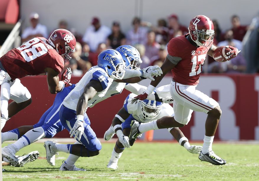 Alabama running back Kenyan Drake (17) runs the ball in for a touchdown in the first half during an NCAA college football game against Middle Tennessee, Saturday, Sept. 12, 2015, in Tuscaloosa, Ala. (AP Photo/Brynn Anderson)