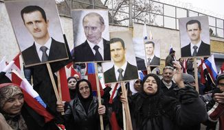 In this Sunday, March 4, 2012, file photo, Syrians hold posters of Syrian President Bashar Assad, far left, and Russian President Vladimir Putin, second left, during a pro-Syrian govermment protest in front of the Russian Embassy in Damascus, Syria. (AP Photo/Muzaffar Salman, File)