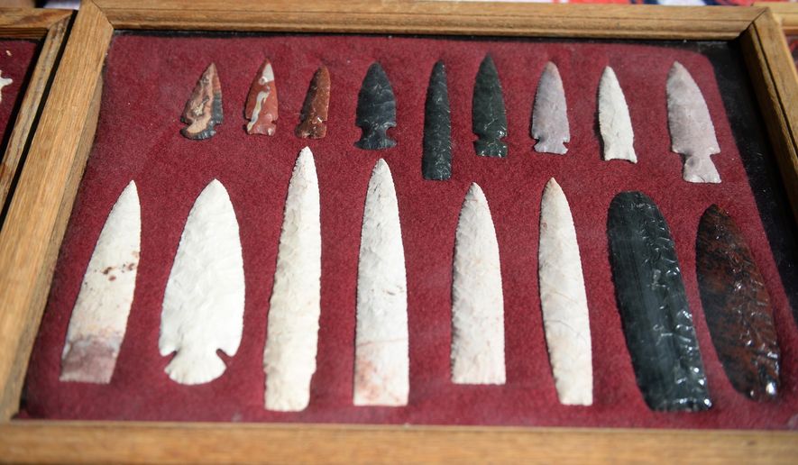 A set of arrowheads are displayed Sunday, Sept. 13, 2015, at Oakland Mills Nature Center in Mount Pleasant, Iowa. People from all over the state of Iowa practiced knapping, an ancient way to create tools such as arrowheads. (Jeff Brown/The Hawk Eye via AP)