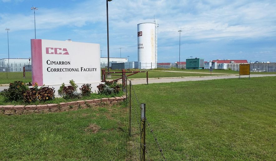 Cimarron Correctional Facility in Cushing, Okla., is viewed Monday, Sept. 14, 2015. The privately run prison where violence erupted over the weekend and left four inmates dead remains on lockdown because of the ongoing investigation. The prison has 1,720 beds and is owned and operated by Corrections Corporation of America. (AP Photo/Kelly Kissel)