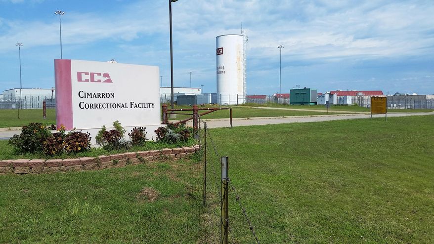 Cimarron Correctional Facility in Cushing, Okla., is viewed Monday, Sept. 14, 2015. The privately run prison where violence erupted over the weekend and left four inmates dead remains on lockdown because of the ongoing investigation. The prison has 1,720 beds and is owned and operated by Corrections Corporation of America. (AP Photo/Kelly Kissel)