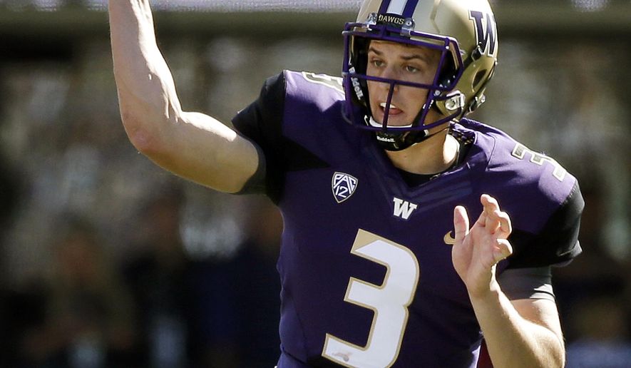 FILE - In this Sept. 12, 2015, file photo, Washington quarterback Jake Browning throws against Sacramento State in the first half of an NCAA college football game in Seattle.  It was clear freshman quarterback Jake Browning was going to have an impact for Washington. He&#39;s not the only youngster showing up for the Huskies. Their leading rusher after two weeks is also a freshman, Myles Gaskin. (AP Photo/Elaine Thompson, File)