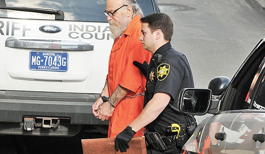 FILE - In this Aug. 13, 2015 file photo, Lewis Fogle, left, is escorted to the back door of the Indiana County Courthouse by Deputy Dave Angelo in Indiana, Pa. The Indiana County district attorney is scheduled to announce on Monday, Sept. 14, 2015 whether he&#39;ll retry Fogle for second-degree murder in the rape and shooting death of a 15-year-old girl in 1976. Fogle, who spent 34 years in prison for the crime, had a judge vacate his murder conviction, citing new DNA evidence. (Tom Peel/The Indiana Gazette via AP, File)
