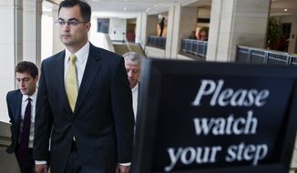Bryan Pagliano, a former State Department employee who helped set up and maintain a private email server used by Hillary Rodham Clinton, departs Capitol Hill in Washington on Sept. 10, 2015, to give his deposition to a House panel on the Benghazi investigation. Pagliano will assert his constitutional right not to testify before any congressional committees, his lawyer says. (Associated Press) **FILE**