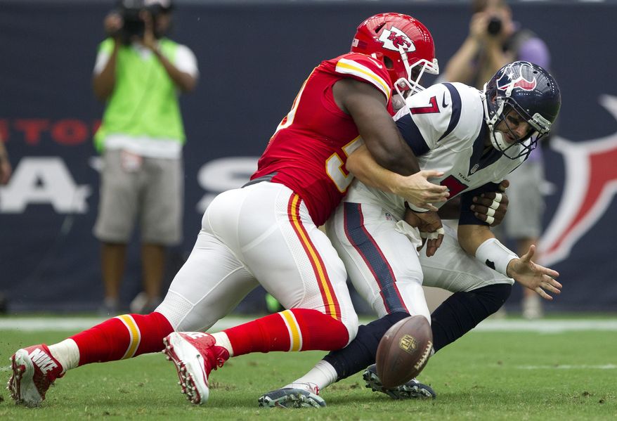 Kansas City Chiefs outside linebacker Justin Houston strip sacks Houston Texans quarterback Brian Hoyer during an NFL football game Sunday, Sept. 13, 2015, in Houston. (Jason Fochtman/Conroe Courier via AP) MANDATORY CREDIT