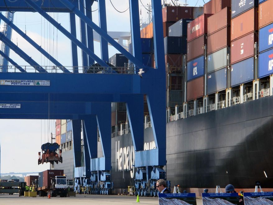In this Feb. 18, 2015 photo, a container ship is unloaded at the Wando-Welch Terminal in Mount Pleasant, S.C. A report released on Monday, Sept. 14, 2015 finds that the South Carolina ports generate $53 billion annually for the state's economy. (AP Photo/Bruce Smith)