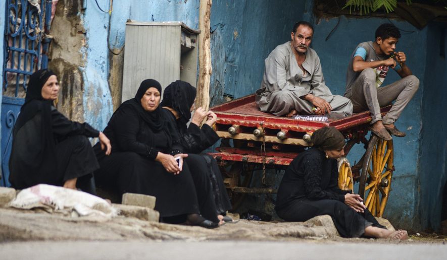 Relatives of an Egyptian victim who was killed in Sunday&#39;s incident in which Egyptian forces mistakenly opened fire on tourists in the western desert, wait at a morgue in Cairo, Egypt, Monday, Sept. 14, 2015. Egyptian forces hunting militants in the country&#39;s western desert mistakenly opened fire on Mexican tourists on safari, killing 12 people and dealing a further blow to the government&#39;s efforts to project an image of stability as it fights an increasingly powerful insurgency, officials said Monday. (AP Photo/Mohamed Elraai)