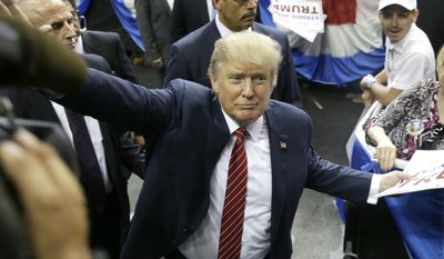 Republican presidential candidate Donald Trump waves to supporters after speaking at a campaign event in Dallas on Sept. 14, 2015. (Associated Press)