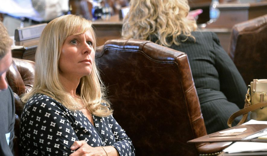 FILE - In this Sept. 10, 2015 file photo, State Rep. Cindy Cindy Gamrat looks at the voting board during hearings in Lansing, Mich. The extramarital affair between Gamrat and Rep. Todd Courser became public last month, ultimately leading to both Republicans losing their seats. (Dale G. Young/Detroit News via AP, File) DETROIT FREE PRESS OUT; HUFFINGTON POST OUT; MANDATORY CREDIT