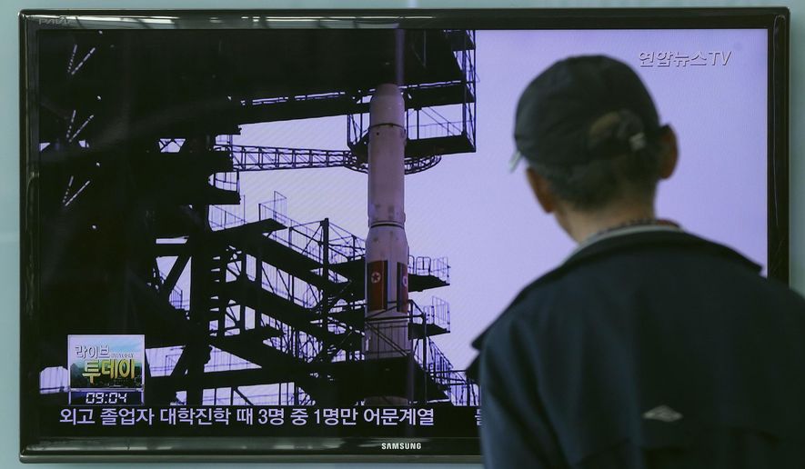 A South Korean man watches TV news program showing a file footage of the Unha rocket in North Korea, at Seoul Railway Station in Seoul, South Korea, Tuesday, Sept. 15, 2015. North Korea said Monday it is ready to launch satellites aboard long-range rockets to mark a key national anniversary next month, a move expected to rekindle animosities with its rivals South Korea and the United States. (AP Photo/ahn Young-joon)
