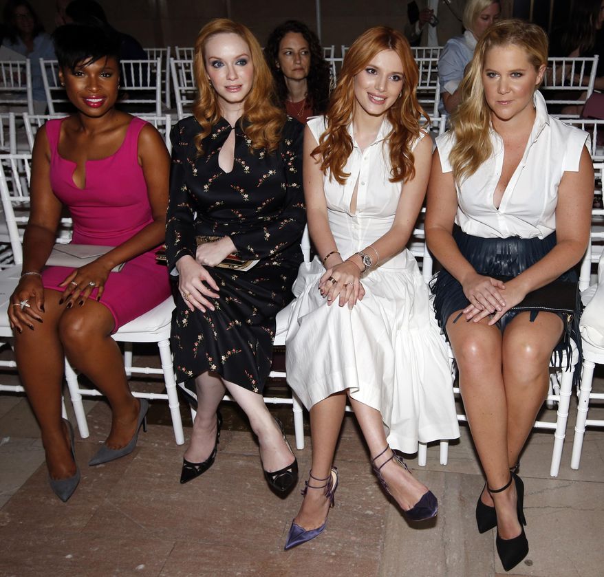 Actresses Jennifer Hudson, from left, Christina Hendricks, Bella Thorne and Amy Schumer sit in the front row before the Zac Posen Spring 2016 collection show during Fashion Week, Monday, Sept. 14, 2015, in New York. (AP Photo/Jason DeCrow)