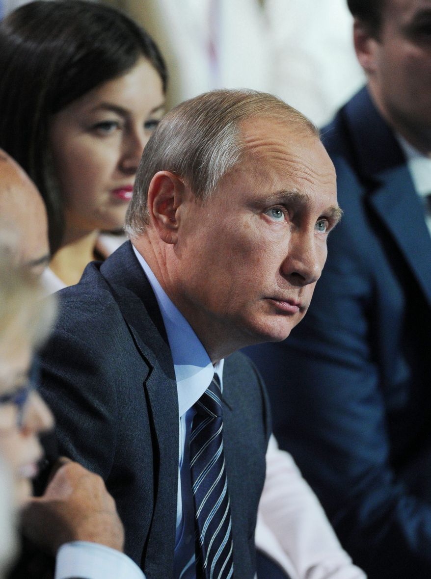 Blame game: Russian President Vladimir Putin, while bolstering military aid to Syria, said U.S. moves have deepened the ongoing refugee crisis. (Associated Press)