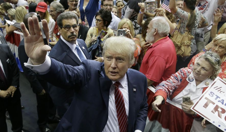 Republican presidential candidate Donald Trump waves to supporters after speaking at a campaign event in Dallas on Sept. 14, 2015. (Associated Press) **FILE**