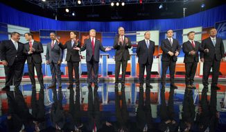 In this Aug. 6, 2015, file photo, Republican presidential candidates from left, Chris Christie, Marco Rubio, Ben Carson, Scott Walker, Donald Trump, Jeb Bush, Mike Huckabee, Ted Cruz, Rand Paul, and John Kasich take the stage for the first Republican presidential debate in Cleveland. (AP Photo/Andrew Harnik, File)