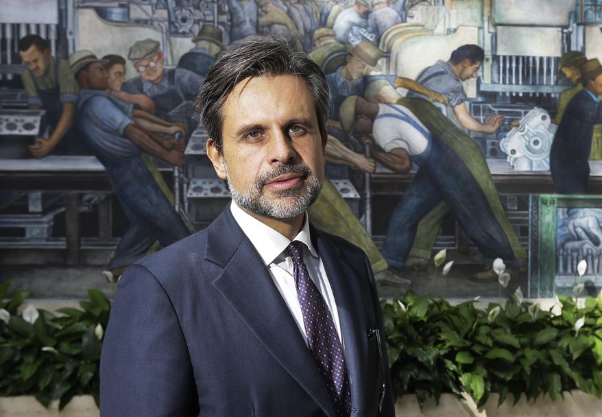 Salvador Salort-Pons, stands in the Diego Rivera court after being introduced as the Detroit Institute of Arts director, Wednesday, Sept. 16, 2015 in Detroit. Salort-Pons was executive director of collection strategies and information who played a key role in the museum's strategic planning process. The museum's board named the 45-year-old, who has served as director of the museum's European Art Department since 2011, as director, president and CEO effective Oct. 15. (AP Photo/Carlos Osorio)