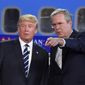 Republican presidential hopeful Jeb Bush defended his brother, former President George W. Bush, against criticism from Donald Trump Wednesday night, saying &quot;he kept us safe.&quot; (Associated Press)