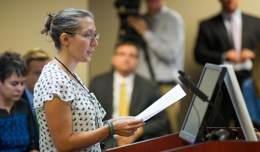 Andrea Zelinski, the news editor of the Nashville Scene and the president-elect of the state chapter of the Society of Professional Journalists, speaks at a hearing in Nashville, Tenn., on Wednesday, Sept. 16, 2015, in opposition to a legislative proposal to allow government officials to charge citizens to view public records. (AP Photo/Erik Schelzig)