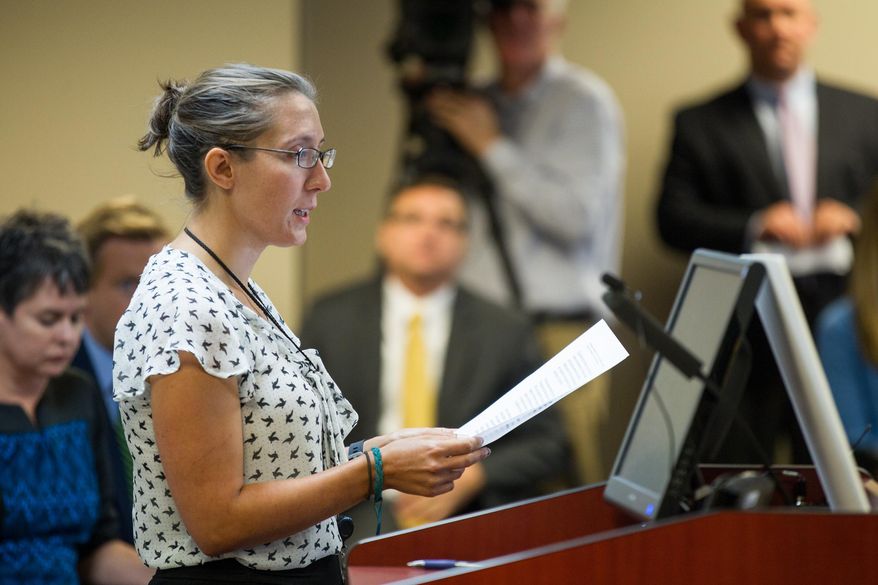 Andrea Zelinski, the news editor of the Nashville Scene and the president-elect of the state chapter of the Society of Professional Journalists, speaks at a hearing in Nashville, Tenn., on Wednesday, Sept. 16, 2015, in opposition to a legislative proposal to allow government officials to charge citizens to view public records. (AP Photo/Erik Schelzig)