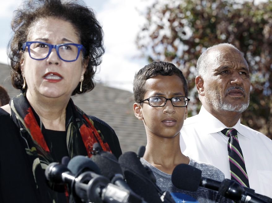 Ahmed Mohamed, 14, center, and his father Mohamed Elhassan Mohamed, right, look on as their attorney Linda Moreno, left, delivers a statement about the arrest of Ahmed during a news conference, Wednesday, September 16, 2015, in Irving, Texas. Ahmed was arrested after a teacher thought a homemade clock he built was a bomb. (AP Photo/Brandon Wade) ** FILE **