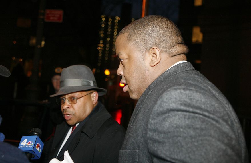 FILE- In this March 10, 2011 file photo, Brooklyn Assemblyman William Boyland, right, exits Federal Court in New York. The former state assemblyman from a family of Brooklyn politicians was sentenced Thursday, Sept. 17, 2015 to 14 years in prison in a scheme to take bribes from a carnival promoter and two undercover FBI agents posing as out-of-town real estate investors. (AP Photo/David Karp, File)