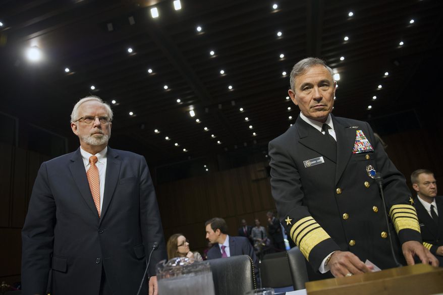 Assistant Defense Secretary of Defense for Asian and Pacific Security Affairs David Shear, left, and Adm. Harry Harris, Jr., US Navy Commander, U.S. Pacific Command, take their seats on Capitol Hill in Washington, Thursday, Sept. 17, 2015, prior to testifying before the Senate Armed Services Committee hearing on maritime security strategy in the Asia-Pacific region. (AP Photo/Cliff Owen)