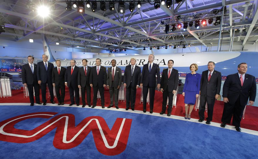 Republican presidential candidates, from left, former Pennsylvania Sen. Rick Santorum, former New York Gov. George Pataki, Sen. Rand Paul, R-Ky., former Arkansas Gov. Mike Huckabee, Sen. Marco Rubio, R-Fla., Sen. Ted Cruz, R-Texas, retired neurosurgeon Ben Carson, businessman Donald Trump, former Florida Gov. Jeb Bush, Wisconsin Gov. Scott Walker, businesswoman Carly Fiorina, Ohio Gov. John Kasich, and New Jersey Gov. Chris Christie take the stage during the CNN Republican presidential debate at the Ronald Reagan Presidential Library and Museum on Wednesday, Sept. 16, 2015, in Simi Valley, Calif. (AP Photo/Chris Carlson)