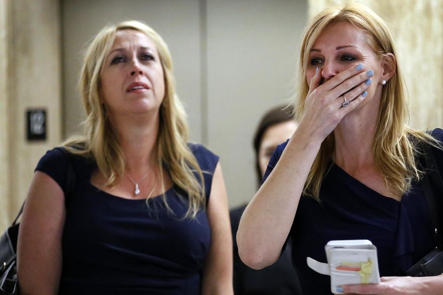 This May 13, 2015, file photo shows Sarah Key-Marer, left, mother of 4-year-old Lauren Sarene Key who was slain in 2000, reacting with her best friend Annette Watling, right, after Cameron Brown was found guilty on murder charges in the death of his daughter Lauren. (Al Seib/Los Angeles Times via AP, File)