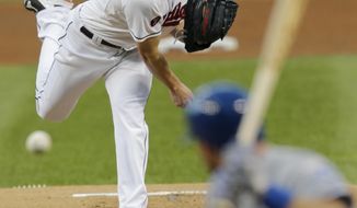 Cleveland Indians starting pitcher Corey Kluber delivers to Kansas City Royals’ Ben Zobrist during the first inning of a baseball game, Thursday, Sept. 17, 2015, in Cleveland. (AP Photo/Tony Dejak)