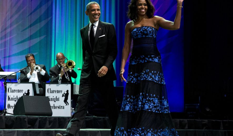 President Barack Obama and first lady Michelle Obama arrive at the Congressional Black Caucus Foundation’s 45th Annual Legislative Conference Phoenix Awards Dinner at the Walter E. Washington Convention Center in Washington, Saturday, Sept. 19, 2015, where the president spoke about the challenges facing black women, particularly in the areas of education, employment and criminal justice. (AP Photo/Carolyn Kaster)