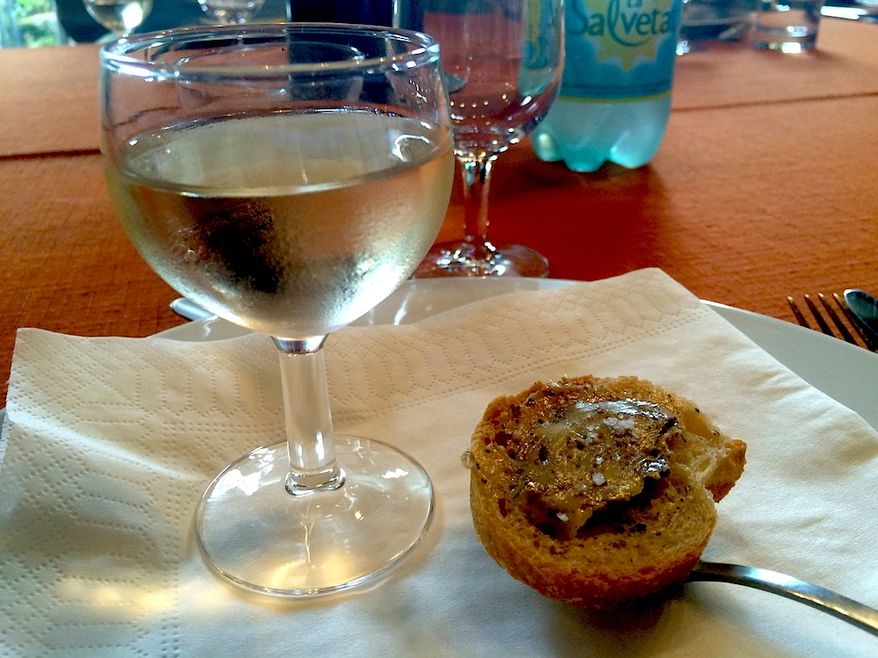 Bread smeared with Black Truffle Butter. (Lark Gould/Special to The Washington Times)