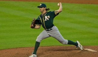 Oakland Athletics pitcher Barry Zito pitches in relief of starter Aaron Brooks to the Houston Astros in the eighth inning of a baseball game Sunday, Sept. 20, 2015, in Houston. (AP Photo/Richard Carson)