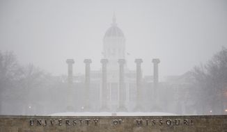 Royce de R. Barondes, an associate professor of law at the University of Missouri, is challenging the campus&#x27; policy that &quot;the possession of firearms on university property is prohibited except in regularly approved programs or by university agents or employees in the line of duty.&quot; (Associated Press)