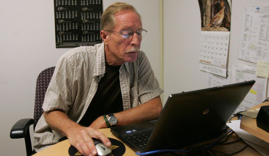 Sgt. Steve Petersen sits at a computer at the Black Hawk County Sheriff&#39;s Office in Waterloo, Iowa, in this undated recent photo. The sheriff&#39;s office tracks people required to provide information for the Iowa Sex Offender Registry. (Dennis Magee/The Courier via AP) MANDATORY CREDIT