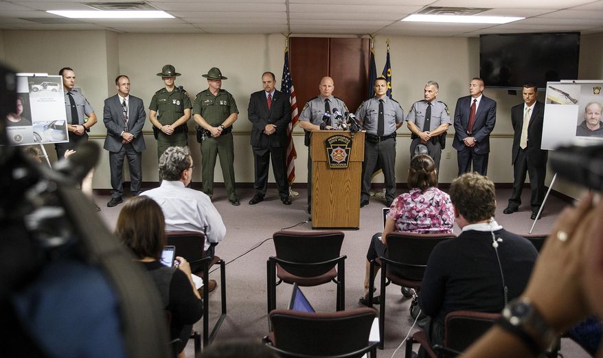 State police Troop H Commander Adam Kosheba speaks during a press conference at the at state police Troop H, Harrisburg station, Monday, Sept. 21, 2015 in West Hanover Township, Pa. The Pennsylvania State Police, and the Franklin County District Attorney’s Office, announced the arrest of John Wayne Strawser Jr., of West Virginia, for murder in the Jan. 4, 2014, shooting incident on Interstate 81 in Franklin County that left Timothy "Asti" Davison dead. (Dan Gleiter/PennLive.com via AP)
