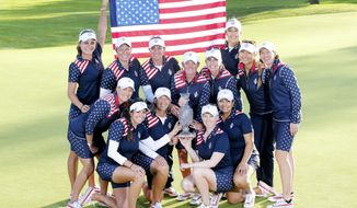 Team United States celebrate with the trophy after beating Europe in the Golf Solheim Cup in St.Leon-Rot, Germany, Sunday, Sept. 20, 2015. U.S. Paula Creamer defeated Germany&#x27;s Sandra Gal to complete a remarkable comeback as United States won the Solheim Cup with a 14½-13½ victory over Europe on Sunday. Creamer made five birdies in 15 holes to win the final singles match 4 and 3 and give the U.S. its first title since 2009. ( AP Photo/Michael Probst)
