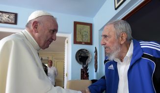 Pope Francis and Cuba&#39;s Fidel Castro shake hands, in Havana, Cuba, Sunday, Sept. 20, 2015. The Vatican described the 40-minute meeting at Castro&#39;s residence as informal and familial, with an exchange of books. (AP Photo/Alex Castro)