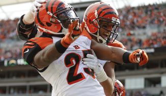 Cincinnati Bengals tight end Tyler Eifert, right, celebrates with running back Giovani Bernard (25) after scoring a touchdown in the second half of an NFL football game against the San Diego Chargers, Sunday, Sept. 20, 2015, in Cincinnati. (AP Photo/Gary Landers)