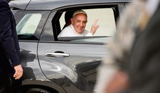 Pope Francis travels in a Fiat 500L as his motorcade makes its way to Washington. (Associated Press)