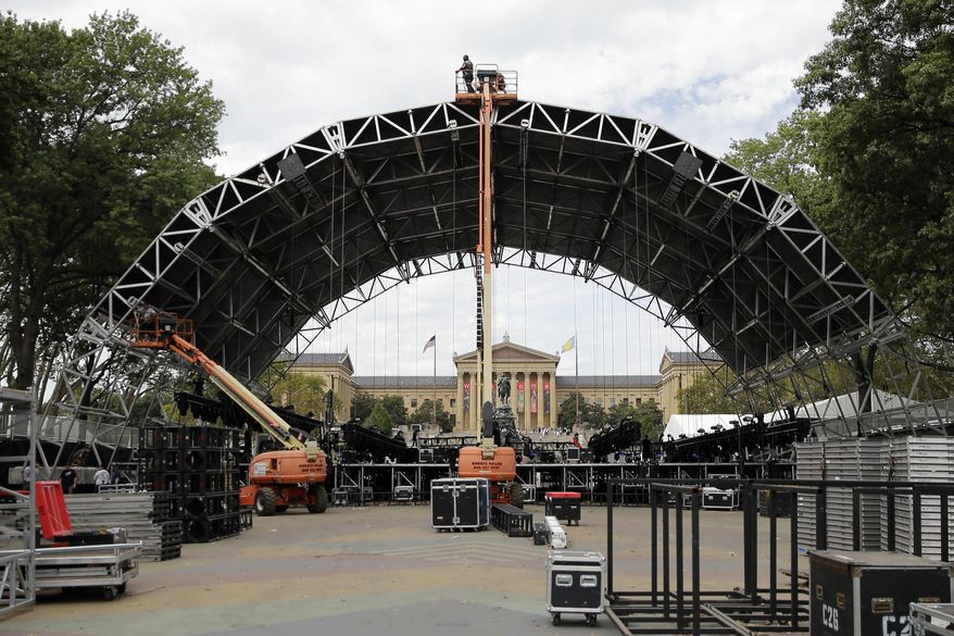 Workmen construct a stage ahead of the World Meeting of Families and Pope Francis's scheduled visit Monday, Sept. 21, 2015, in Philadelphia. Francis arrives in Philadelphia on Saturday. (AP Photo/Matt Rourke)