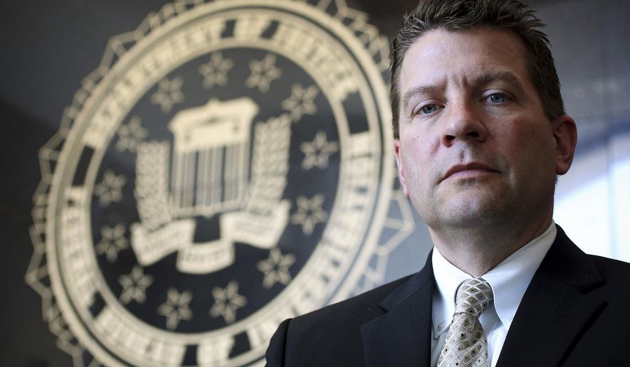 FILE - In this Sept. 14, 2012 file photo, Michael Anderson, FBI Special Agent in Charge in New Orleans, poses in his office. According to an FBI news release from Washington, Anderson has been named special agent in charge of the bureau's Chicago Division. Anderson will report to Chicago in mid-October 2015. (Rusty Costanza/NOLA.com The Times-Picayune via AP, File) NO SALES; MAGS OUT; USA TODAY OUT; BATON ROUGE ADVOCATE OUT; NEW ORLEANS ADVOCATE OUT; MANDATORY CREDIT