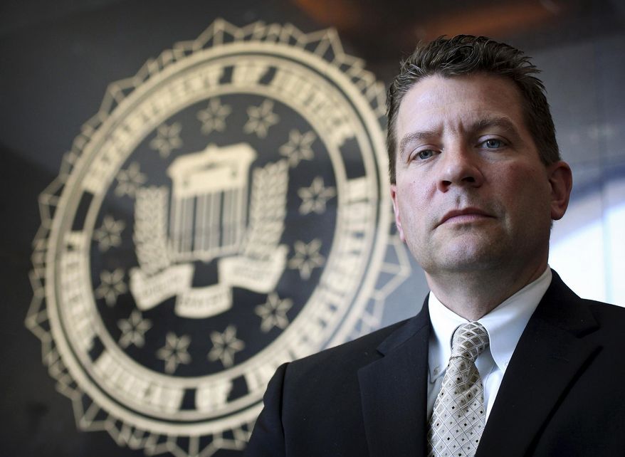 FILE - In this Sept. 14, 2012 file photo, Michael Anderson, FBI Special Agent in Charge in New Orleans, poses in his office. According to an FBI news release from Washington, Anderson has been named special agent in charge of the bureau's Chicago Division. Anderson will report to Chicago in mid-October 2015. (Rusty Costanza/NOLA.com The Times-Picayune via AP, File) NO SALES; MAGS OUT; USA TODAY OUT; BATON ROUGE ADVOCATE OUT; NEW ORLEANS ADVOCATE OUT; MANDATORY CREDIT