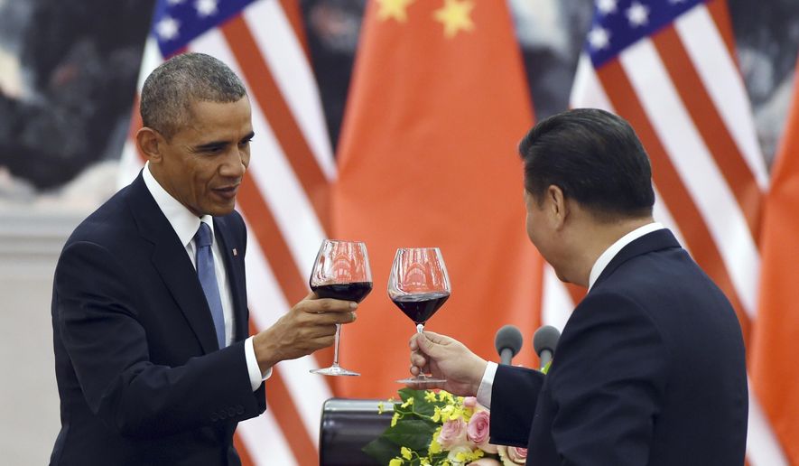 In this Nov. 12, 2014, file photo, President Barack Obama toasts with Chinese President Xi Jinping at a lunch banquet in the Great Hall of the People in Beijing. (AP Photo/Greg Baker, File-Pool)