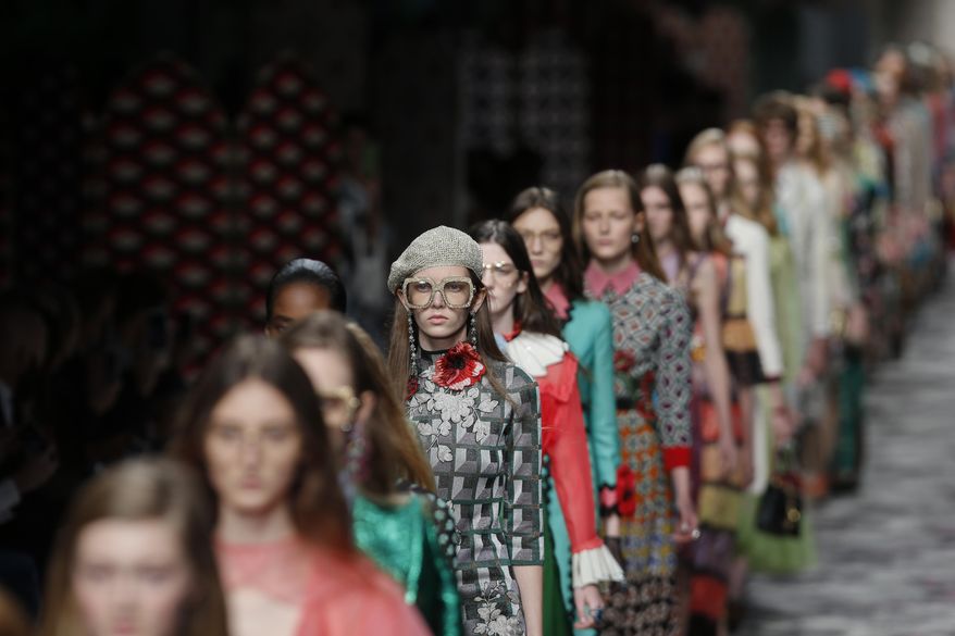 Models wear creations for Gucci women's Spring-Summer 2016 collection, part of the Milan Fashion Week, unveiled in Milan, Italy, Wednesday, Sept. 23, 2015. (AP Photo/Luca Bruno)