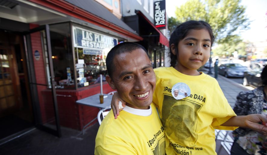 Raul Cruz, from suburban Los Angeles, holds his daughter Sophie Cruz, 5, after an interview with the Associated Press in Washington, Wednesday, Sept. 23, 2015. Sophie crossed a police barricade to greet Pope Francis during his parade. (AP Photo/Alex Brandon)