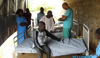 Dr. Tom Catena treats patients seeking help at the Mother of Mercy Hospital in the Nuba Mountains. Source: Sudan Relief Fund.
