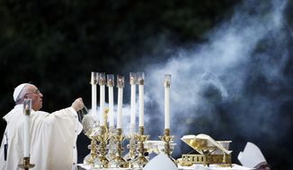 Pope Francis conducts Mass outside the Basilica of the National Shrine of the Immaculate Conception on Wednesday, Sept. 23, 2015, in Washington. (Associated Press)