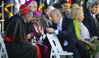 Vice President Joe Biden, right, leans back to talk with Vatican Secretary of State Cardinal Pietro Parolin, left, and other members of the Catholic leadership as they all wait for Pope Francis to arrive before the start of the State Arrival on the South Lawn of the White House, Washington, Wednesday, Sept. 23, 2015. (AP Photo/Pablo Martinez Monsivais)