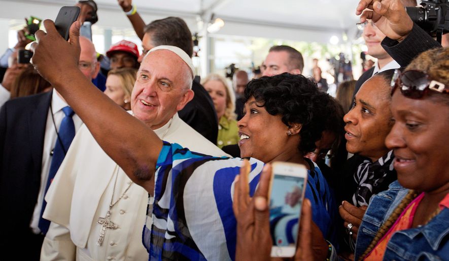 Amid Pope Francis&#39; first-ever visit to the U.S. this week, some analysts are digging into the books to note the amount of money the American government doles out to Catholic charities every year. (Associated Press)